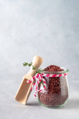 Red wine flavored salt in in a glass jar. Gourmet condiment to aromatize and season food Dessert, Seafood, Meats, Pasta, Sauce, Finishing Salt