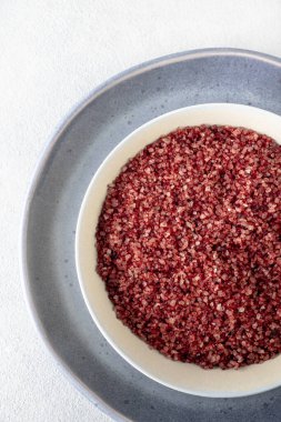 Red wine flavored salt in a bowl. Gourmet condiment to aromatize and season food Dessert, Seafood, Meats, Pasta, Sauce, Finishing Salt