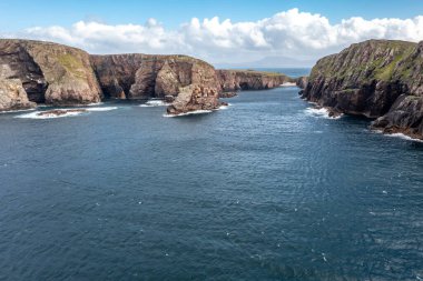 The cliffs and sea stacks at Port Challa on Tory Island, County Donegal, Ireland.