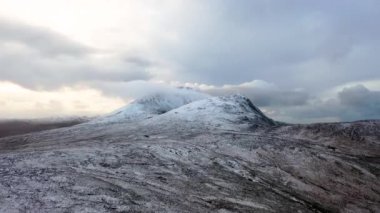 The snow covered Mount Errigal, the highest mountain in Donegal - Ireland