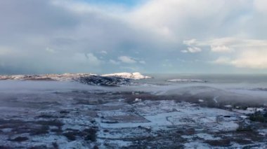 Aerial view of snow covered Clooney and Portnoo in County Donegal, Ireland