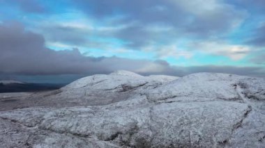 Croloughan Lough next to the snow covered Mount Errigal, the highest mountain in Donegal - Ireland