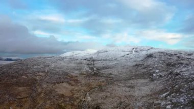 Flying towards Croloughan Lough next to the snow covered Mount Errigal, the highest mountain in Donegal - Ireland