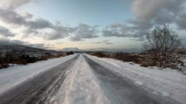 The road from Church Hill towards Glenveagh with the Muckish mountain in the background , County Donegal. Republic of Ireland.