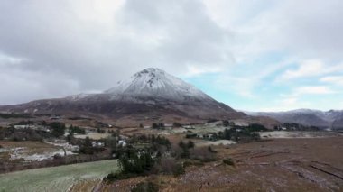 The snow covered Mount Errigal, the highest mountain in Donegal - Ireland