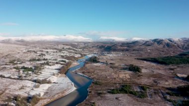 Aerial view of snow covered Gweebarra River between Doochary and Lettermacaward in Donegal - Ireland.