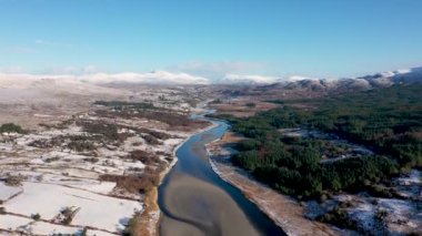 Aerial view of snow covered Gweebarra River between Doochary and Lettermacaward in Donegal - Ireland.