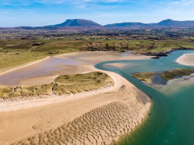 Aerial view of Ballyness Bay and Magheraroarty with the Muckish in the background in County Donegal - Ireland.