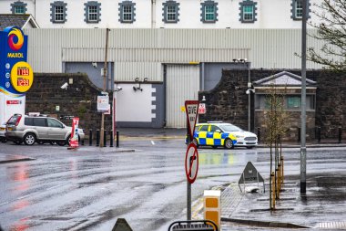ENNISKILLEN, ULSTER, NORTHERN IRELAND - MARCH 03 2019 : The Kesh police station is protected by a huge fence a couple of days before the Brexit. clipart