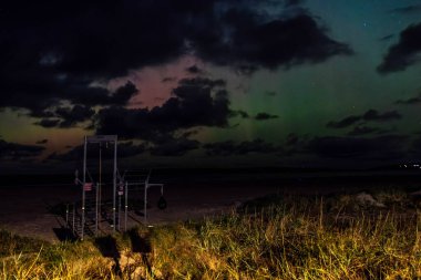 The Aurora Borealis, the northern lights, showing up in Portnoo, County Donegal, Ireland clipart