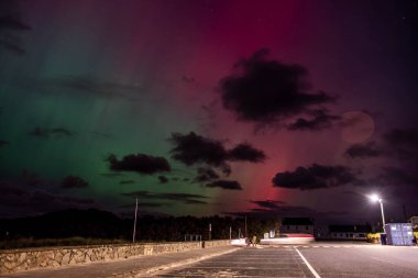 The Aurora Borealis, the northern lights, showing up in Portnoo, County Donegal, Ireland clipart