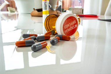 PORTNOO, COUNTY DONEGAL, IRELAND - APRIL 13 2023 : Antibiotics lying on a white table. clipart