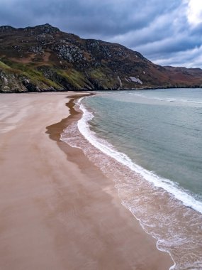 Aerial view of the beach and caves at Maghera Beach near Ardara, County Donegal - Ireland clipart