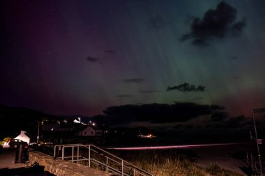 The Aurora Borealis, the northern lights, showing up in Portnoo, County Donegal, Ireland clipart