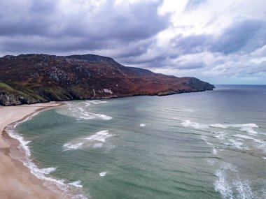 Aerial view of the beach and caves at Maghera Beach near Ardara, County Donegal - Ireland clipart