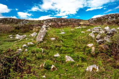 The beautiful rocks next to the scenic coastal single track road between Meenacross and Crohy Head south of Dungloe, County Donegal - Ireland. clipart