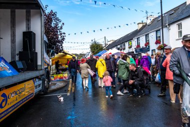GLENTIES, COUNTY DONEGAL, IRELAND - SEPTEMBER 13 2025 : Local influencer Donegaldaddy is working hard at the Harvest Fair on the Mainstreet.