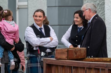 GLENTIES, COUNTY DONEGAL, IRELAND - SEPTEMBER 14 2025 : St. Nauls Pipes and Drums is enjoying the free Glenties Harvest Fair on the main street.