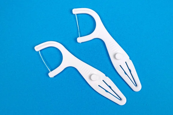 Zahnseide Picks Auf Blauem Hintergrund Dentalhygienekonzept — Stockfoto