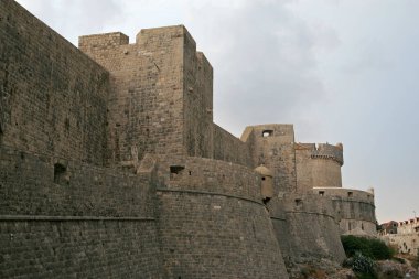 Walls of Dubrovnik - defensive stone walls surrounding the city of Dubrovnik in Croatia clipart