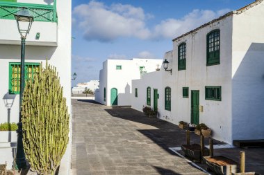 Picturesque white and green settlement called Pueblo Marinero designed by Cesar Manrique located in Costa Teguise, Lanzarote, Canary Island, Spain clipart
