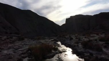 Stream of water on the bottom of  the canyon at Tabernas Desert, Andalusia, Spain,