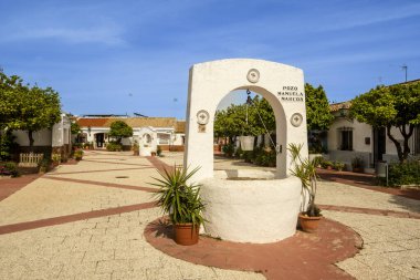 Beautiful Square with old wells, Frederico Maya street, Ayamonte, Spain clipart