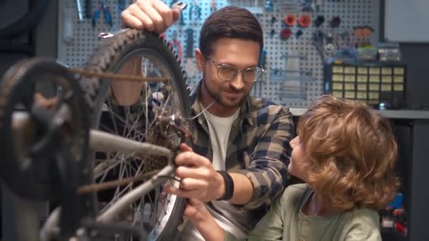 Portrait Little Cute Kid Repairing Bicycle Happy Loving Dad Looking — Stock Video