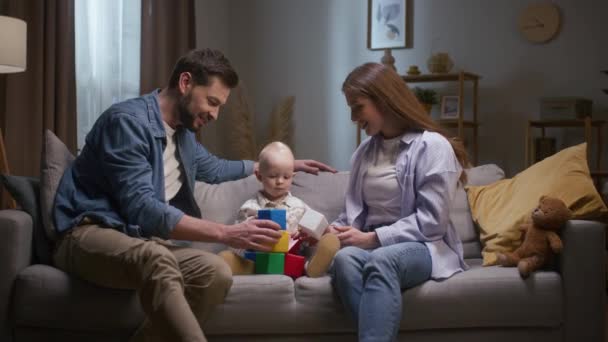 Young Parents Spending Evening Baby Son Cheerful Family Playing Sitting — Stock Video