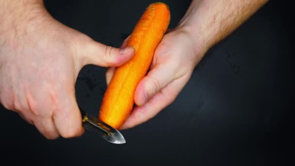 Man Peeling Carrots Male Hands Peeling Peel Carrot Carrots Peeler — Stock Video