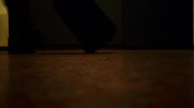 Walking feet. Low angle shot. Video of walking people from a lower angle. Many walking human legs. A crowd of people hurrying about their business. Fast motion. Accelerated movement. Time lapse