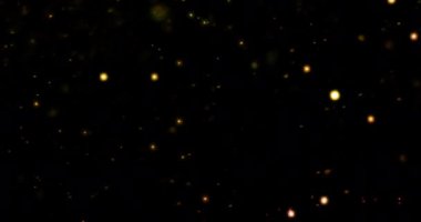 Altın parıldayan Noel arkaplanı Bokeh ile yüzüyor, altın bayram mutlu yıllar