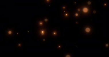 Noel 'de, yeni yıl hareketlerinde altın parıltılı noktalar ve parçacıklar yavaşça siyah arka planda süzülüyor, bayram ve olay