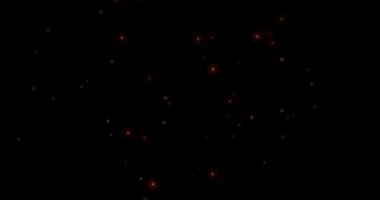 Noel 'de, yeni yıl hareketlerinde altın parıltılı noktalar ve parçacıklar yavaşça siyah arka planda süzülüyor, bayram ve olay