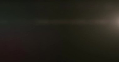 Çoklu renk sızıntısı, ışıltılı bir Noel arkaplanı Bokeh ile birlikte yüzüyor, mutlu yıllar.