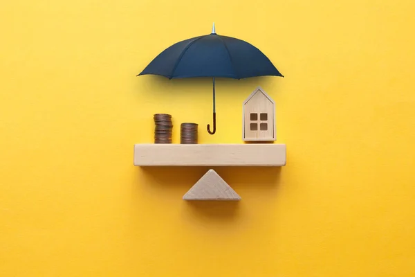 Umbrella Protecting Seesaw Balance House Coins Property Insurance Concept — Stock Photo, Image
