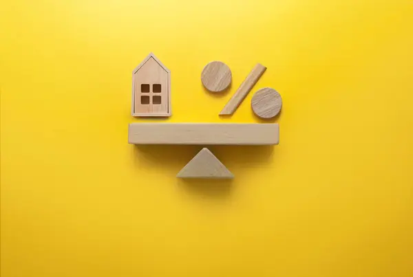 Miniature House Percentage Sign Balanced Seesaw Royalty Free Stock Images