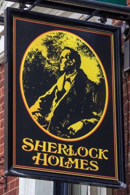 Londra, İngiltere - 23 Mart 2023: Londra, İngiltere 'deki Northumberland Caddesi' ndeki Sherlock Holmes barının girişindeki tabela.