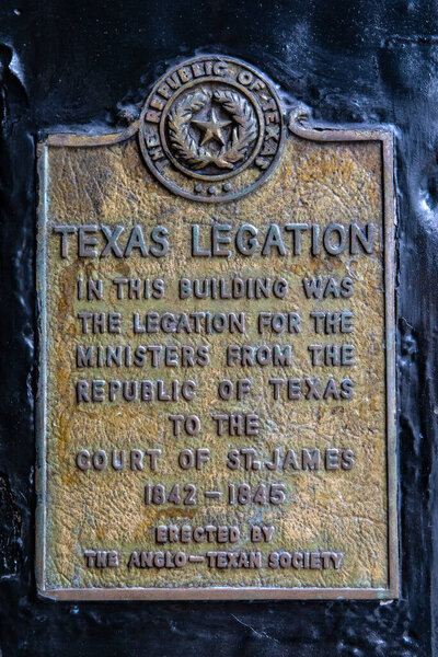 London, UK - February 19th 2024: Plaque on the exterior of Berry Bros and Rudd wine merchants, marking the location of the former Texas Legation in the 1800s.