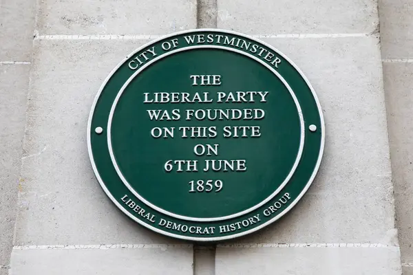 stock image London, UK - February 19th 2024: A plaque on King Street in London, UK, marking the location where the Liberal Party was founded in 1859.