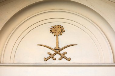 London, UK - February 26th 2024: The national emblem of Saudi Arabia on the exterior of the Embassy of Saudi Arabia, located in Mayfair, London, UK. clipart