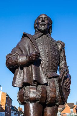 Stratford-Upon-Avon, UK - February 12th 2024: Statue of famous playwright William Shakespeare in Stratford-Upon-Avon - his birthplace in Warwickshire, UK. clipart