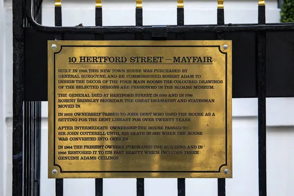 stock image London, UK - February 26th 2024: A plaque at number 10 Hertford Street in Mayfair, London, detailing the interesting history of the building.