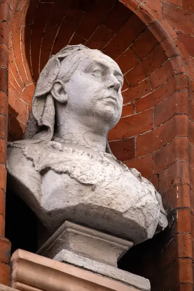 stock image London, UK - February 26th 2024: A bust of Queen Victoria, located on the exterior of a building on Mount Street in the Mayfair area of London, UK.