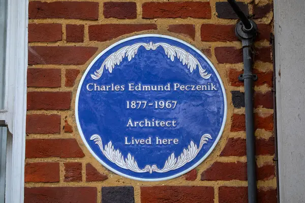 stock image London, UK - February 26th 2024: A blue plaque on Grosvenor Square in London, UK, marking the location where architect Charles Edmund Peczenik lived.