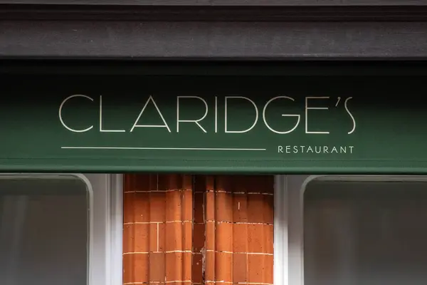 stock image London, UK - February 26th 2024: A sign on the exterior of Claridge's Restaurant, located in the Mayfair area of London, uk.