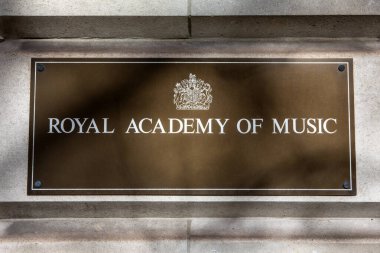 London, UK - March 4th 2024: Sign on the exterior of the historic Royal Academy of Music, located on Marylebone Road in London, UK. clipart