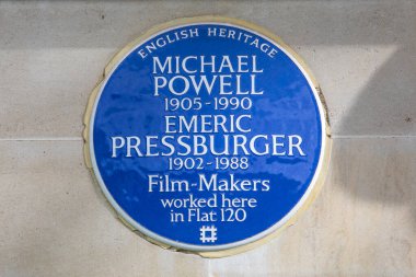 London, UK - March 4th 2024: A blue plaque on Gloucester Place in Marylebone, London, UK, marking where film-makers Michael Powell and Emeric Pressburger worked. clipart