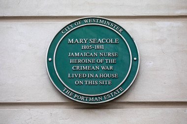 London, UK - March 18th 2024: A green plaque on George Street in London, marking the location where famous nurse Mary Seacole once lived. clipart
