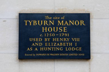 London, UK - March 18th 2024: A plaque on Marylebone High Street in London, marking the former site of Tyburn Manor House, used by Henry VIII and Elizabeth I. clipart